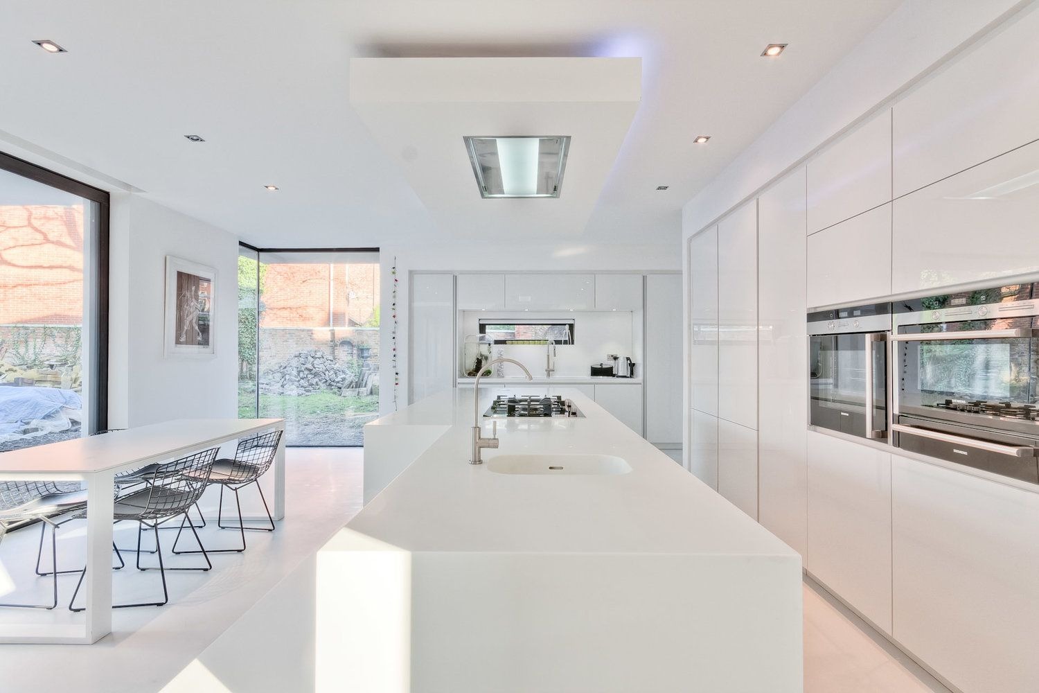 A bright white kitchen · savings hero